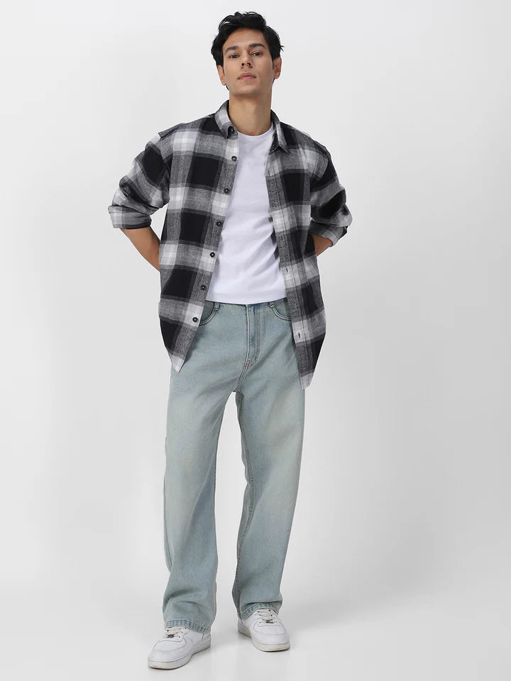 dress shirt with baggy jeans The Best Shirts to Wear With Baggy Jeans, Per Our Stylists